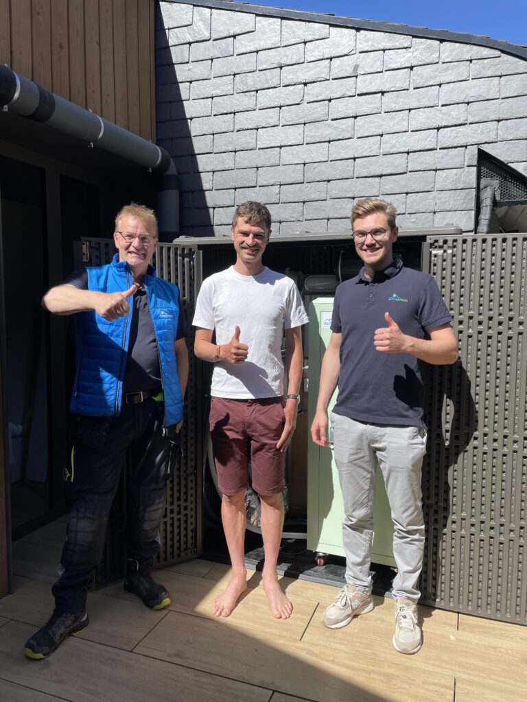 Altitude Spaces team posing with Jay Vine in front of his altitude installation at home